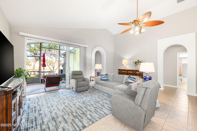 tiled living room with lofted ceiling and ceiling fan