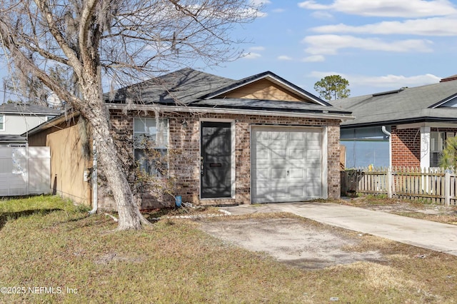 view of front of house with a garage and a front yard