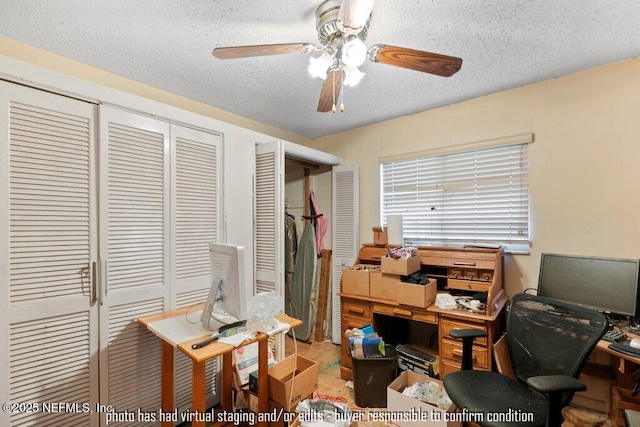 office area featuring ceiling fan and a textured ceiling