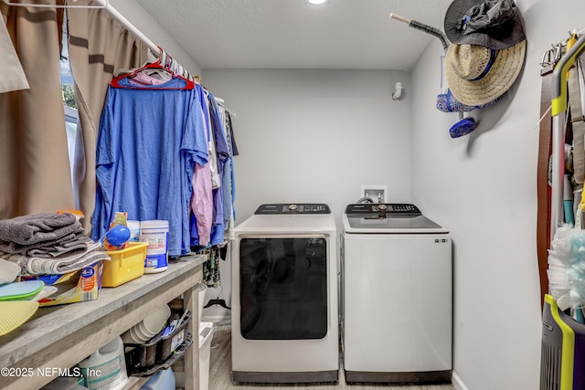 laundry room featuring separate washer and dryer