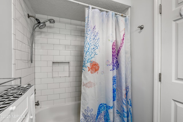 bathroom featuring shower / tub combo and a textured ceiling