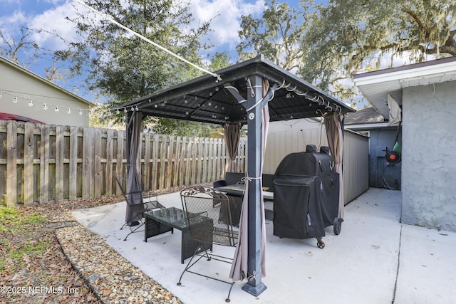 view of patio / terrace with a gazebo and a grill