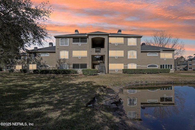 view of outdoor building at dusk