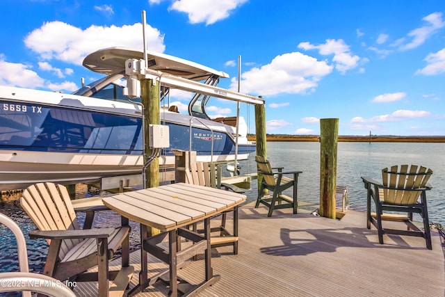 exterior space featuring a water view and a dock