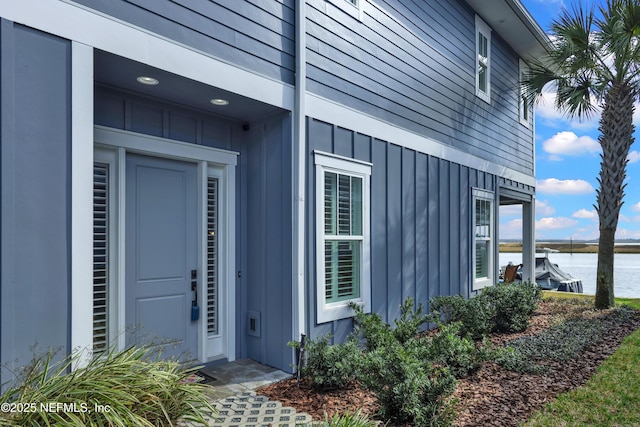 entrance to property with a water view