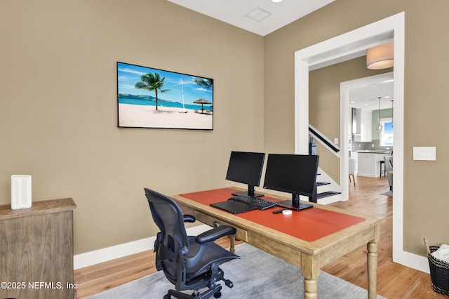 office with hardwood / wood-style flooring