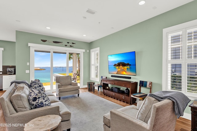 living room with light hardwood / wood-style flooring