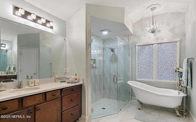 bathroom with vanity, a chandelier, shower with separate bathtub, and a textured ceiling