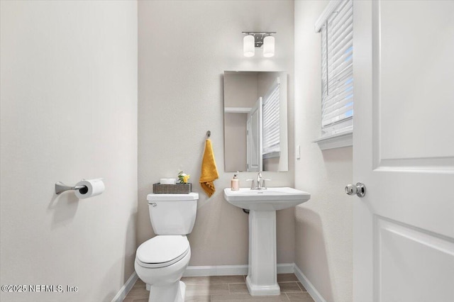 bathroom with sink and toilet