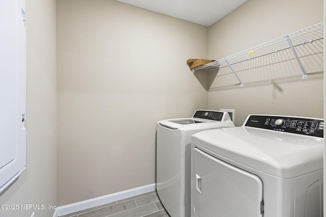 laundry room with washing machine and dryer