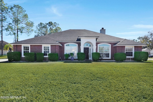 view of front of property with a front lawn