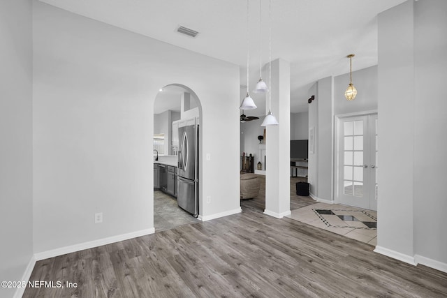 interior space with light hardwood / wood-style flooring and french doors