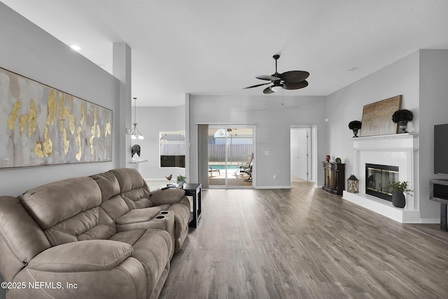 living room featuring ceiling fan and hardwood / wood-style floors