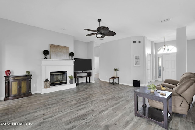 living room with ceiling fan and hardwood / wood-style floors