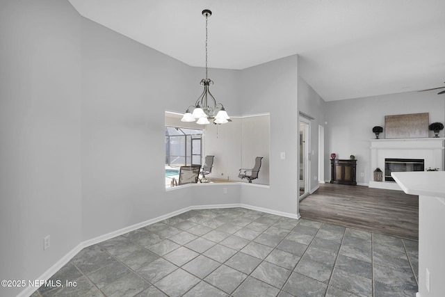 unfurnished dining area featuring a chandelier