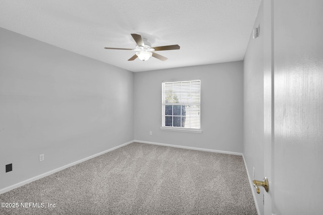 empty room with carpet floors and ceiling fan