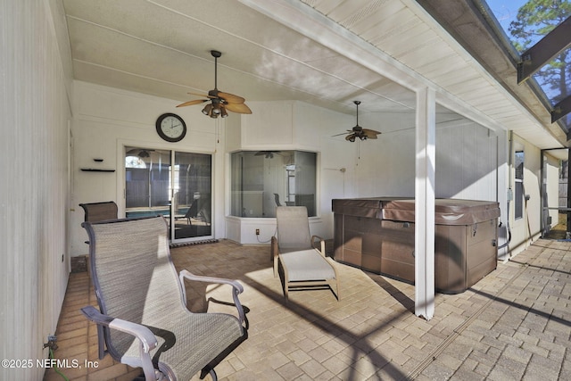 view of patio featuring a hot tub and ceiling fan