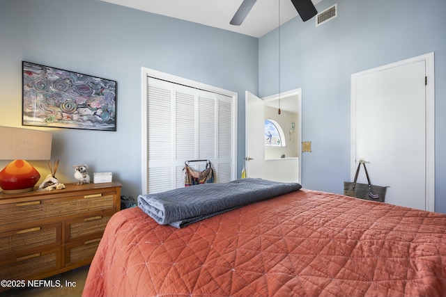 bedroom with lofted ceiling, a closet, and ceiling fan