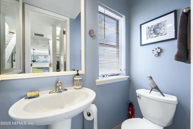 bathroom featuring sink and toilet