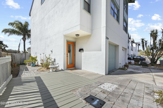 view of exterior entry featuring a garage