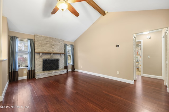 unfurnished living room with ceiling fan, vaulted ceiling with beams, a brick fireplace, and dark hardwood / wood-style flooring