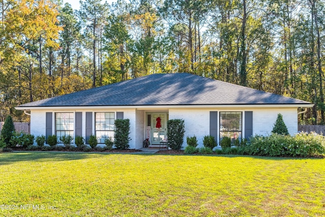 ranch-style house featuring a front lawn