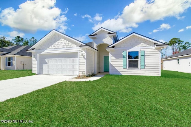 view of front of home featuring a garage and a front lawn