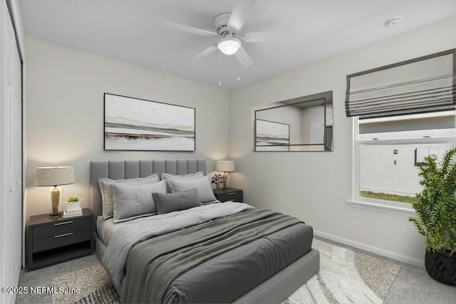 bedroom featuring ceiling fan and light colored carpet