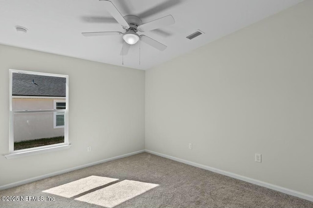 carpeted empty room with ceiling fan