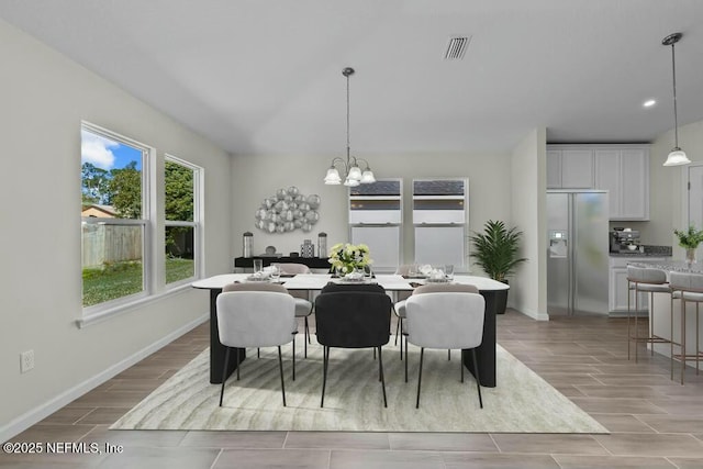 dining area featuring a chandelier