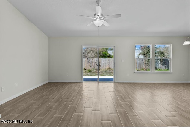 unfurnished room with ceiling fan