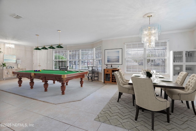 game room featuring ornamental molding, a healthy amount of sunlight, a notable chandelier, and light tile patterned floors