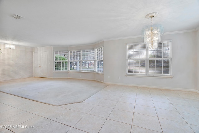 carpeted empty room with crown molding and an inviting chandelier