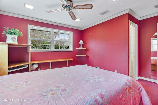 unfurnished bedroom with crown molding, ceiling fan, carpet floors, and multiple windows