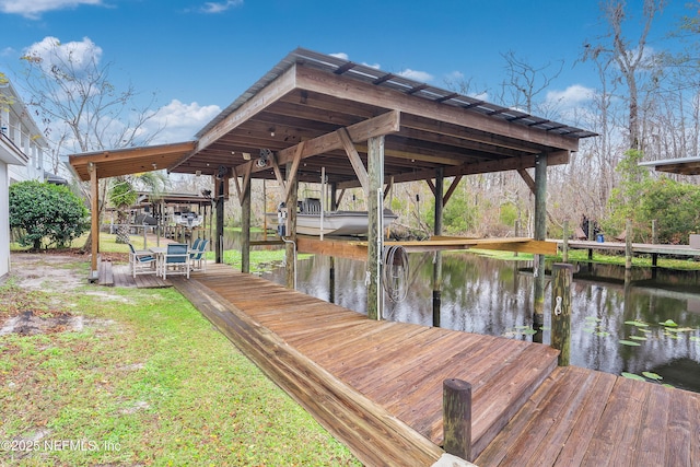 dock area featuring a water view