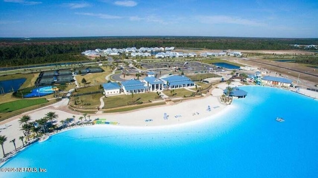 bird's eye view with a water view and a view of the beach