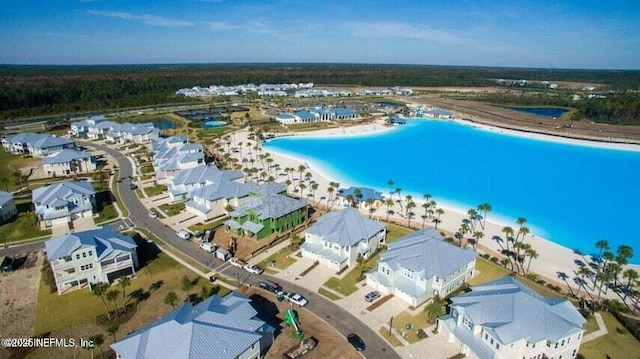 drone / aerial view with a view of the beach and a water view