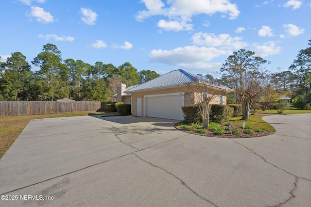 view of side of property with a garage