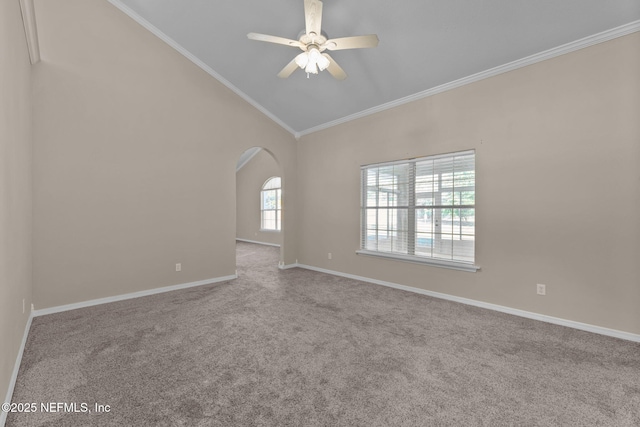 empty room featuring ornamental molding, high vaulted ceiling, light carpet, and ceiling fan