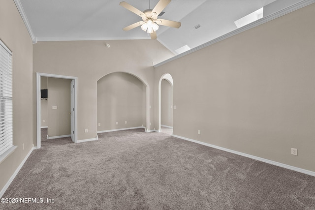 unfurnished room with crown molding, ceiling fan, high vaulted ceiling, and carpet