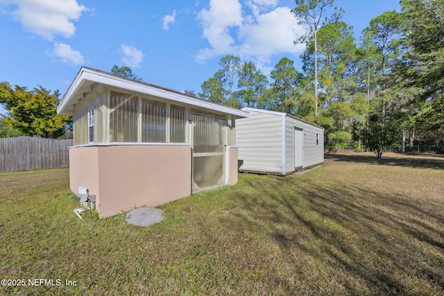 view of side of home featuring a lawn