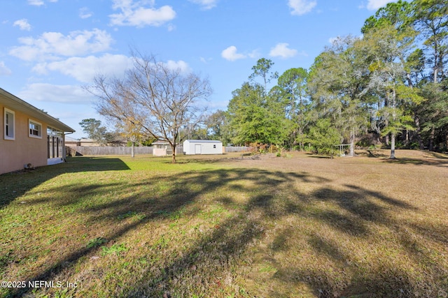 view of yard with a storage shed