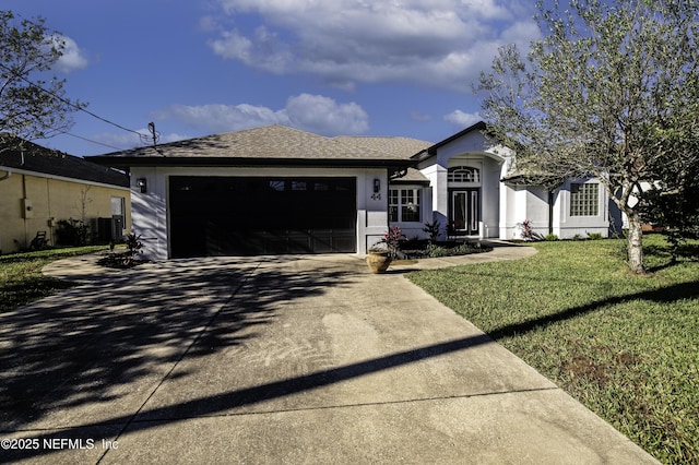 ranch-style home featuring a garage and a front lawn