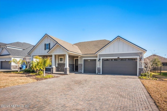 craftsman-style house featuring a garage and a porch