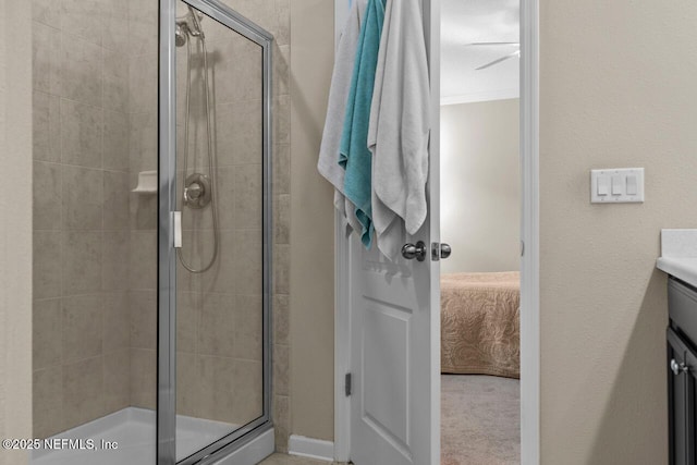 bathroom with an enclosed shower and vanity