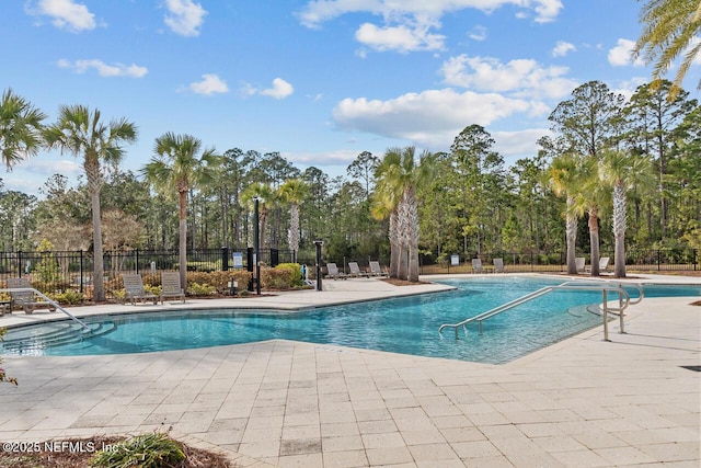 view of pool featuring a patio area