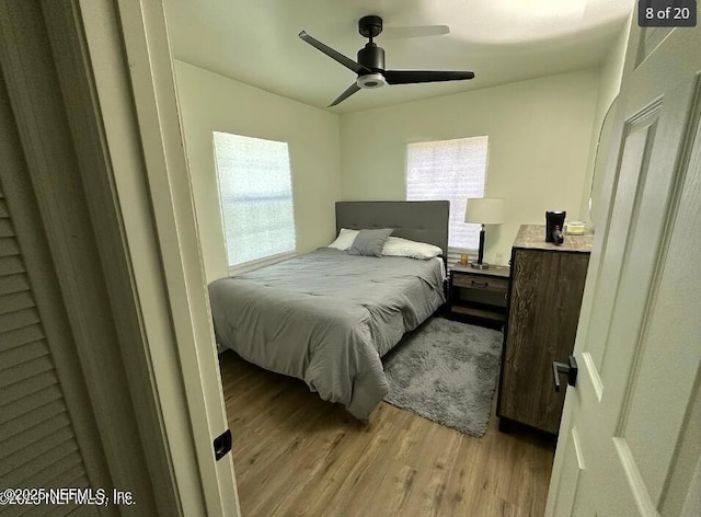 bedroom with light wood-type flooring and ceiling fan