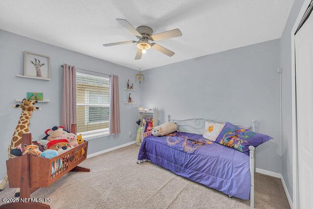 bedroom with carpet and ceiling fan