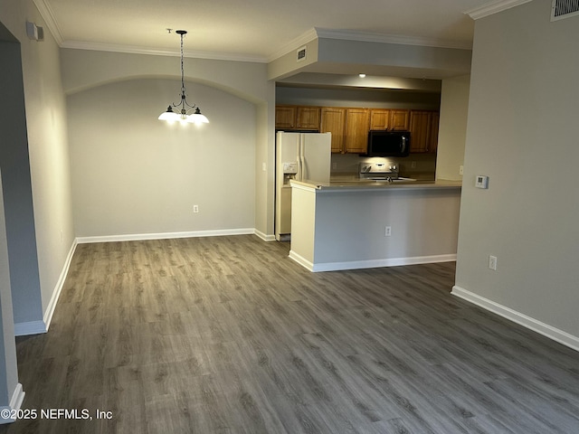 kitchen with stainless steel electric range oven, white refrigerator with ice dispenser, decorative light fixtures, an inviting chandelier, and kitchen peninsula