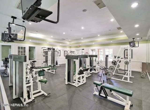 gym featuring a tray ceiling